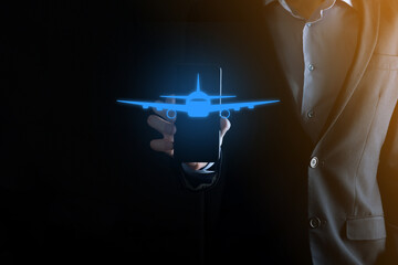 Businessman holding an airplane icon in his hands. Online ticket purchase.Travel