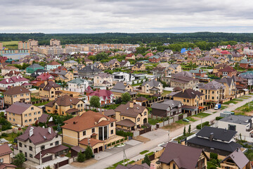 Fototapeta na wymiar private houses in a suburban neighborhood, top view