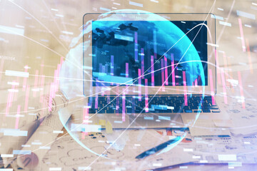 Financial graph colorful drawing and table with computer on background. Double exposure. Concept of...