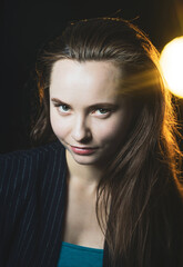 Naklejka premium Emotional portrait of a young beautiful girl in Vogue style. Expressive eyes and energetic gaze. Advertising photography. Perfumes, cosmetics and fashionable style.