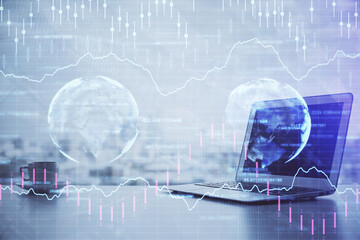 Forex Chart hologram on table with computer background. Multi exposure. Concept of financial markets.