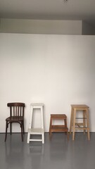 a variety of studio equipment for a photo studio, decor items for work for photographers, vintage furniture for a photo studio, a variety of wooden chairs stools