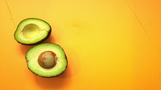 Avocado abacate fruit, table orange isolated background

