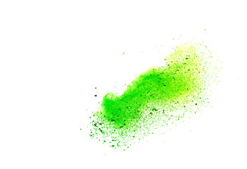 Freeze motion of green color powder exploding on white background.