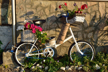 White Bicycle  with flowers.