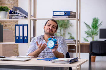 Hungry male employee waiting for food in time management concept