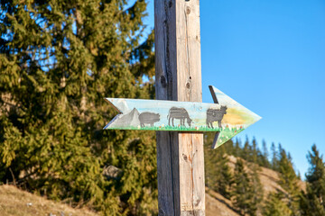 Alpine sign with animals on it