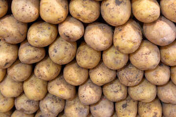 Close-up, potatoes standing in a row on the counter in the marketplace