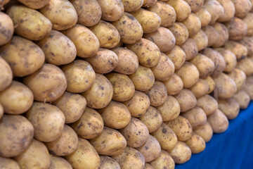 Close-up, potatoes standing in a row on the counter in the marketplace