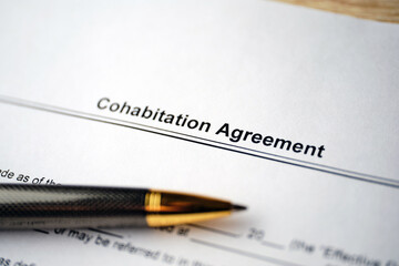 Legal document Cohabitation Agreement on paper with pen