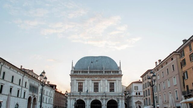 Time lapse of loggia place or square during a sunny cloudy day at the sunset. Location: Brescia, Lombardy, Italy