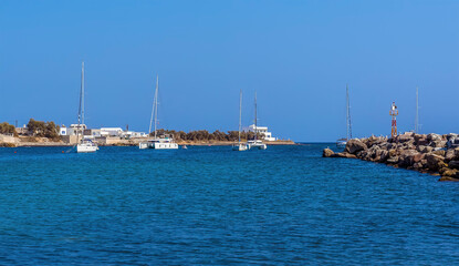 The view towards the harbour entrance at Vlychada in Santorini in summertime