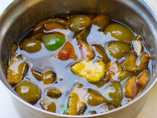 feijoa berry jam is cooked in a saucepan