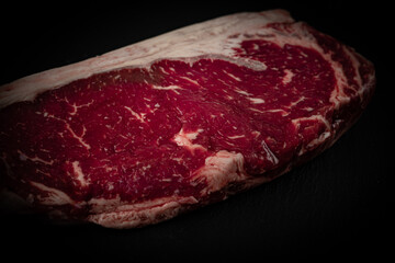 Raw ribeye beef steak. Texture of marble meat. Top view. 