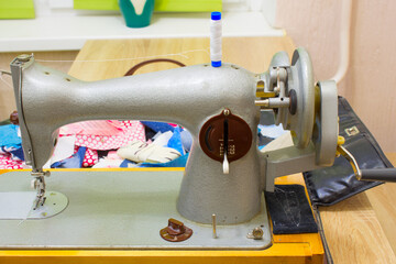 the sewing machine is on the table