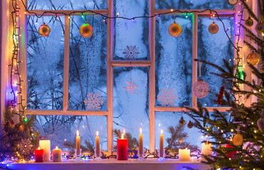 Christmas decorations on old wooden window
