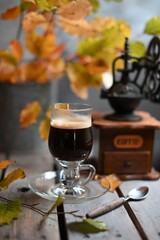 Autumn leaves, Coffee Grinder and cup of black coffee. Background for website, bloggers, social media. 