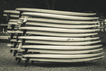 Stack of surfboards by the lake