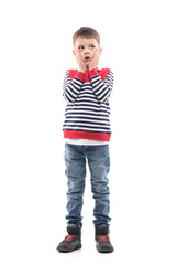 Thinking young serious cute little boy looking up confused touching cheeks. Full body portrait...