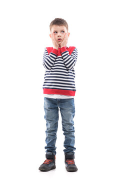 Thinking young serious cute little boy looking up confused touching cheeks. Full body portrait isolated on white background. 
