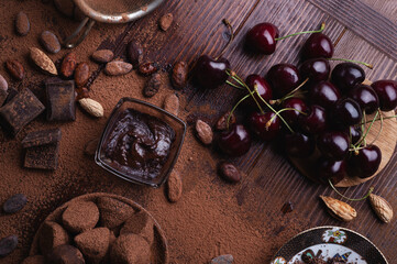 art background with healthy delicious dark truffles, chocolate  and  ingridients:  natural cocoa...