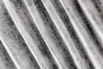 Close up pattern of a clean air furnace or air conditioning filter.