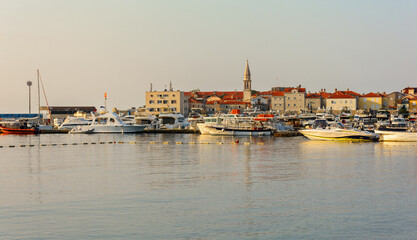 Fototapeta na wymiar Port in Budva. Marina for yachts and boats. Dawn. Montenegro.