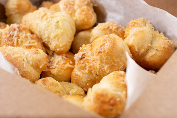 A closeup view of a box of garlic knots.