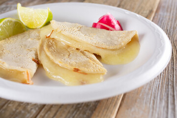 A view of a plate of small quesadillas.