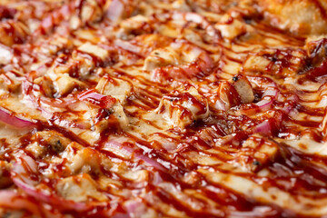 A closeup view of a BBQ chicken pizza.