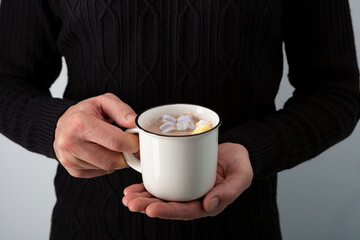 Hot winter beverages in hands