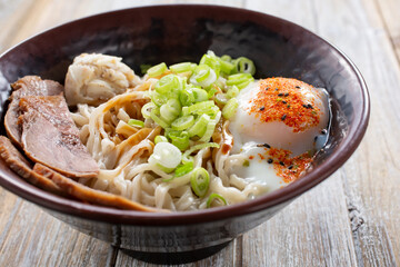 A view of a bowl of butter garlic noodles.