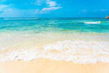 Beautiful tropical empty beach sea ocean with white cloud on blue sky