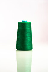 Industrial green spool on white background  