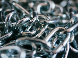 Heavy and bundled chains. Industrial concept. Black background