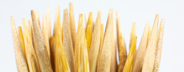 Wooden toothpicks macro photo. Close up background.