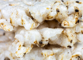 Healthy crispbread on white background. Vegetarian and diet food. Close up photo.