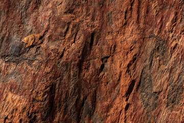 Close-up abstract natural stone texture. Background for packaging and design. Stone wall pattern.