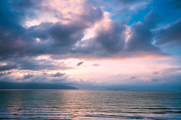 Half sea and sky between island on a cloudy evening