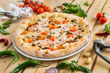 tasty pizza on the wooden background
