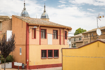 the town hall and the domes of the church in Alcala de Ebro, province of Zaragoza, Aragon, Spain