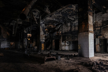 Fototapeta na wymiar Burnt interior of industrial building or warehouse. Consequences of fire