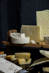 Traditional Greek cheeses on a dark background