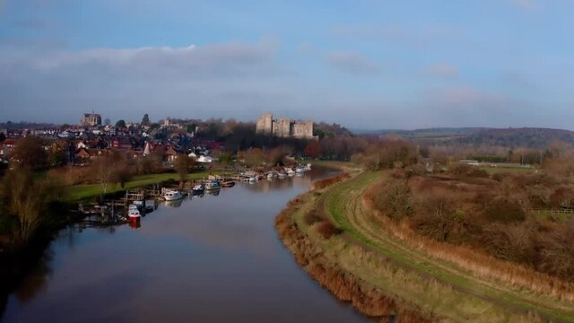 Beautiful Arundel in West Sussex revealed from the air over the scenic River Arun with Arundel Castle and the Cathedral dominating the landscape.