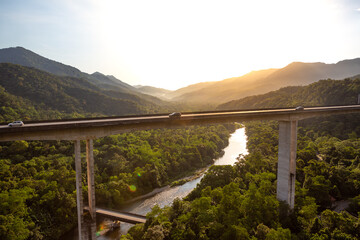View of the Atlantic Forest and Serra do Mar crossed by the huge bridges of the Imigrantes highway, Sao Paulo, Brazil