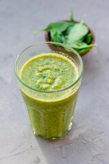 Healthy green smoothie with spinach in a glass mug, drink banner