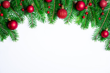 Christmas border background with fir branches and red balls