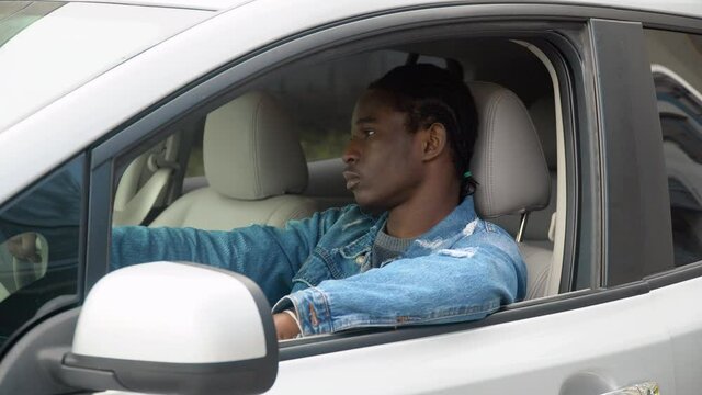 African american man sitting in his luxury car