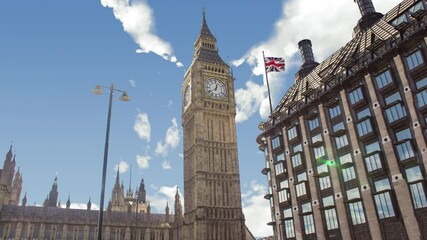 Time lapse of big ben tower or clock during a sunny cloudy day. There is the tower in close up and the clouds in background - Powered by Adobe