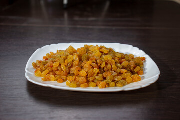 Raisins on a plate. Dried fruits.